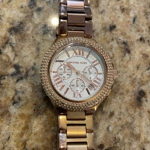 Michael Kors Rose Gold watch w/ bling around the face/rim.